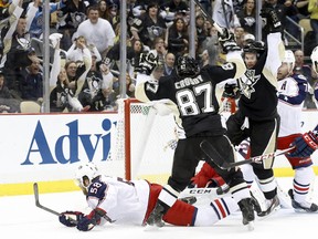 Pittsburgh Penguins centre Sidney Crosby and left winger Chris Kunitz react to a goal by Kunitz against the Columbus Blue Jackets during the second period in Game 5 at the CONSOL Energy Center. (Charles LeClaire/USA TODAY Sports)