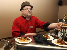 Craig Guenther of Ruby Red's Kansas City Barbecue hands out samples during the #LoveLocalMB Food Beer and Wine Celebration at the Winnipeg Winter Club on Sat., April 26, 2014. (Kevin King/Winnipeg Sun/QMI Agency)