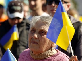 People take part in a pro-Ukrainian rally in Luhansk, eastern Ukraine April 26, 2014. REUTERS/Vasily Fedosenko