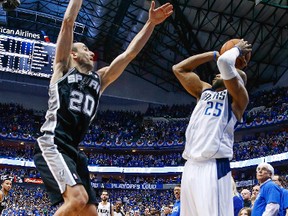 Dallas Mavericks guard Vince Carter (25) hits the game winning shot over San Antonio Spurs guard Manu Ginobili (20) during the fourth quarter in game three of the first round of the 2014 NBA Playoffs at American Airlines Center April 26, 2014, in Dallas. (Kevin Jairaj-USA TODAY Sports/Reuters)