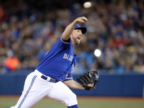 Blue Jays starter R.A. Dickey delivers to the plate against the Red Sox during MLB action in Toronto on Sunday, April 27, 2014.. (Tom Szczerbowski/USA TODAY Sports)