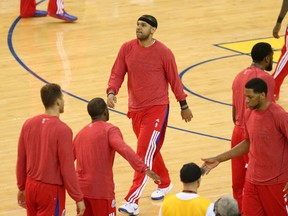 Clippers forward Jared Dudley (black headband) warms up with teammates wearing their warm up clothes inside-out before Game 4 of the first round of the 2014 NBA Playoffs against the Golden State Warriors in Oakland on Sunday, April 27, 2014. (Kelley L. Cox/USA TODAY Sports)