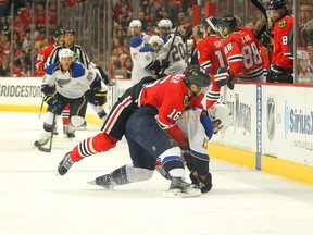 Chicago Blackhawks centre Marcus Kruger is called for holding St. Louis Blues centre Vladimir Sobotka during the first period in Game 6 at the United Center. (Dennis Wierzbicki/USA TODAY Sports)