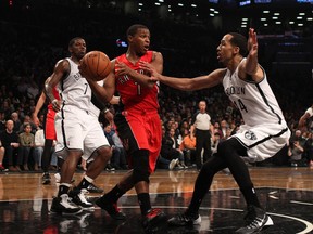 Raptors guard Kyle Lowry is defended by Nets guard Shaun Livingston (right) during the first quarter of Game 4 of their first round playoff series in Brooklyn, N.Y., on Sunday, April 27, 2014. (Adam Hunger/USA TODAY Sports)