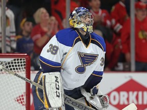 The Blues' Ryan Miller looks up at the replay board after giving up a third-period goal to the  Blackhawks in Game 6 of their series in Chicago on Sunday. With the loss, the Blues were eliminated. (AFP)