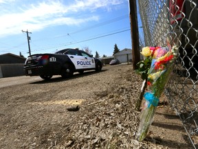 A memorial is left at the scene Sunday at 149 Street and 89 Avenue where a man was slain the day before. PERRY MAH/EDMONTON SUN