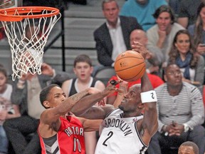 Raptors guard DeMar DeRozan defends against Nets veteran Kevin Garnett during Sunday night’s game in Brooklyn. (USA TODAY SPORTS)