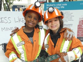 Carol Mulligan/The Sudbury Star
Friends Naomi Burrows, left, 6, and Ammara Grenon, 8, get dressed up like miners at the Modern Mining and Technology Week Showcase at the New Sudbury Centre on Saturday.