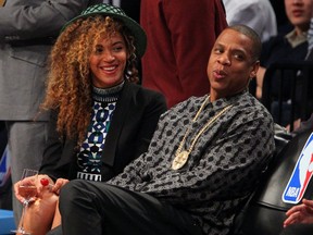 Beyonce and Jay-Z, seen here watching an NBA game in Brooklyn earlier this month, will perform in Winnipeg on July 27. (Ed Mulholland-USA TODAY Sports photo)