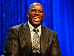 NBA legend Magic Johnson laughs during the 2014 NBA All-Star Game Legends Brunch at Ernest N. Morial Convention Center on Feb 16, 2014 in New Orleans, LA, USA. (Bob Donnan/USA TODAY Sports)