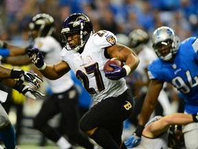 Baltimore Ravens running back Ray Rice (27) runs the ball during the third quarter against the Detroit Lions at Ford Field on Dec 16, 2013 in Detroit, MI, USA. (Andrew Weber/USA TODAY Sports)