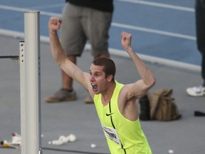 Derek Drouin reacts after clearing 7-10.50 and winning the high jump, Moscow Games Rematch at the Drake Relays on Friday, April 25, 2014, at Drake Stadium in Des Moines, Iowa. (Photo courtesy of Charlie Litchfield/The Des Moines Register)