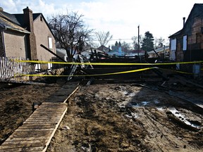 The remnants of a home that burned to the ground overnight at 114 Avenue and 68 Street are seen in Edmonton, Alta., on Monday, April 28, 2014. (Codie McLachlan/Edmonton Sun)