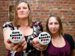 Jerome Lessard The Intelligencer
Trina Elson, left, and Amy Dustin, two Canada Post employees and representatives of Canadian Union of Postal Workers Belleville 502, are seen at Belleville city hall Monday evening.