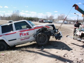 A tow truck pulls the wrecked Whitecourt Fire command vehicle out of the ditch on Highway 43 near West Mountain Road after a head-on collision on Monday, April 28. Neither driver sustained serious injuries in the crash.
Celia Ste Croix photo | Whitecourt Star