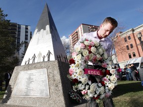 Edmonton and District Labour Council President Bruce Fafard lays a wreath during the EDLC’s 18th Annual International Day of Mourning ceremony at Grant Notley Park, 11603 100 Ave., on Monday. The ceremony was held to recognize workers killed and injured on the job. (DAVID BLOOM/Edmonton Sun)