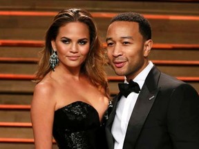 Singer John Legend and wife Chrissy Teigen arrive at the 2014 Vanity Fair Oscars Party in West Hollywood, California March 3, 2014. REUTERS/Danny Moloshok