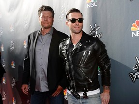 Celebrity coaches Blake Shelton, left, and Adam Levine pose at a media event for the television show "The Voice" in Hollywood, Calif., on April 3, 2014. (REUTERS/Mario Anzuoni)