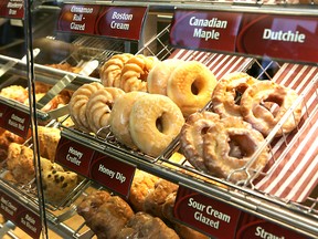Doughnuts are on display at a Tim Hortons in this file photo. (CHRISTOPHER SMITH/QMI Agency)