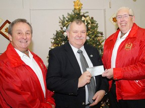 Thomas Lay, left, a past president of The Old Elgin Band, and Bob Holt, right, treasurer, present a $4,000 donation December 14, 2011 to Ian Raven, executive director of the Elgin Military Museum in St. Thomas, Ontario.The band, which had been performing since 1984, has ceased operations and is dispersing of its funds.