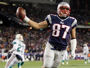 New England Patriots tight end Rob Gronkowski celebrates his touchdown against the Miami Dolphins during the second half of their NFL football game in Foxborough, Massachusetts December 30, 2012. (REUTERS/Jessica Rinaldi)