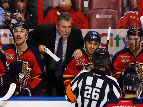 Florida Panthers head coach Peter Horachek questions referee Rob Martell on a no goal call against the Panthers in the second period of a game against the Pittsburgh Penguins at BB&T Center on Nov 30, 2013 in Sunrise, FL, USA. (Robert Mayer/USA TODAY Sports)