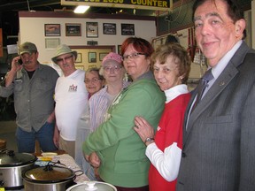 Helping out in Tilbury at a fundraiser for the Chatham-Kent Women's Centre on April 22 were, from left: Todd Beselaere, Jim Stonehouse, and IODE members Doreen Stonehouse, Ethel Dodman, Sara Cracknell and Joanne Garant. With them is Hal Bushey, executive director of the Women's Centre.