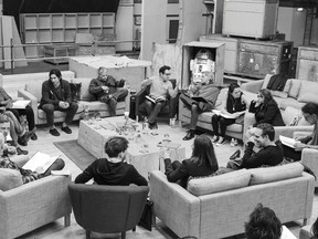 Writer/Director/Producer J.J. Abrams (top center in glasses) conducts a cast reading for "Star Wars: Episode VII" at Pinewood Studios in Buckinghamshire in this publicity photo taken and released to Reuters April 29, 2014. Clockwise from Abrams are Harrison Ford, Daisy Ridley, Carrie Fisher, Peter Mayhew, Producer Bryan Burk, Lucasfilm President and Producer Kathleen Kennedy, Domhnall Gleeson, Anthony Daniels, Mark Hamill, Andy Serkis, Oscar Isaac, John Boyega, Adam Driver and writer Lawrence Kasdan.  REUTERS/David James/Copyright (c) Lucasfilm Ltd. & TM. All Rights Reserved/The Walt Disney Company/Handout