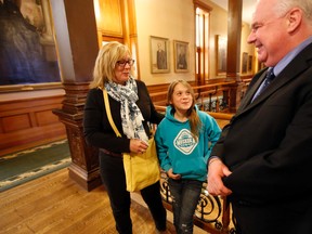 Madi Vanstone and her mother, Beth, who are seeking to have Madi's drugs covered by OHIP, talk with Tory House Leader Jim Wilson at Queen's Park Tuesday April 29, 2014. (Michael Peake/Toronto Sun)