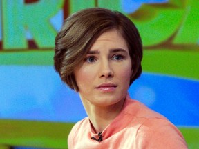 Amanda Knox reacts while being interviewed on the set of ABC's "Good Morning America" in New York January 31, 2014. (REUTERS/Andrew Kelly)