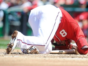 Danny Espinosa #8 of the Washington Nationals on the ground after being hit by a pitch in the second inning against the San Diego Padres at Nationals Park on April 27, 2014 in Washington, DC. (Greg Fiume/Getty Images/AFP)
== FOR NEWSPAPERS, INTERNET, TELCOS & TELEVISION USE ONLY ==