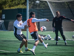 Ottawa Fury FC defender Ramon Soria, left, trains at Carleton University Monday, April 28, 2013 with team mates Mauro Eustaquio, centre and goalkeeper Marcel DeBellis. Soria came into last weekend's 4-0 win over Carolina late in the first half and may start Wednesday against FC Edmonton. The native of Alicante, Spain, also has a law degree and plans to become a sports lawyer following his soccer career. (Chris Hofley/Ottawa Sun)