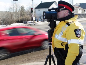 FILE: EPS Cst. Jeff Sliwa takes part in speed enforcement along Scona Road at 94 Avenue, in Edmonton, Alta., on Thursday March 13, 2014. David Bloom/Edmonton Sun