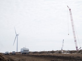 A new Municipal Property Assessment Corp. study suggests wind turbines, like these being built at the Bornish Wind Energy Centre near Parkhill, do not have a "statistically significant impact" on the sale price of residential properties. (Free Press file)