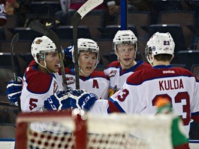 Defenceman Ashton Sautner (from left) joins Brett Pollock, Curtis Lazar and Edgars Kulda in a playoff goal celebration against the Brandon Wheat Kings in early April. (Codie McLachlan, Edmonton Sun)