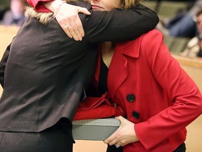 Gino Donato/The Sudbury Star
Susan Belli, wife of the late Ward 8 Coun. Fabio Belli, hugs Mayor Marianne Matichuk after she was given a book on condolences and a Canadian flag at Tuesday night’s council meeting. Council held a tribute to Belli, who passed away suddenly on April 12.
