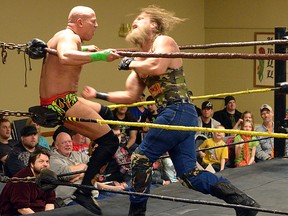 Cody Deaner delivers a body blow during a March CCW match against Derek Wylde. CHRIS ABBOTT/TILLSONBURG NEWS