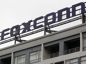 The logo of Foxconn, the trading name of Hon Hai Precision Industry, is seen on top of the company's headquarters in Tucheng, New Taipei city, Dec. 24, 2013. REUTERS/Pichi Chuang