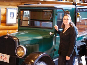 Trisha Carleton, general manager at the KBPV, poses in front of a classic car. file photo/QMI Agency.