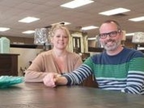 Brother and sister team Chris and Tracey Hodgins show off some of their Mennonite furniture at Wood `N Water.