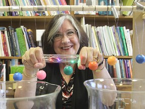 Queen's University's Dr. Lynda Colgan, one of the organizers of the Science Rendezvous, shows an example of the simple experiments children can get to try at the event.
Michael Lea The Whig-Standard