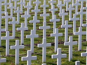 Crosses are seen at the cemetery outside the WWI Douaumont ossuary near Verdun, northeastern France, March 30, 2014.   REUTERS/Charles Platiau