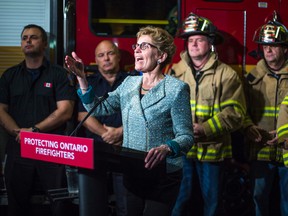 Premier Kathleen Wynne during an announcement at Toronto Fire Station 314 on April 30, 2014. Wynne announced the addition of six new cancers to the list of diseases presumed to be job related for firefighters. (Ernest Doroszuk/Toronto Sun)