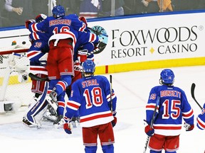 The New York Rangers celebrate defeating the Philadelphia Flyers in Game 7 of their Eastern Conference quarterfinal series at Madison Square Garden in New York, April 30, 2014. (ADAM HUNGER/USA Today)
