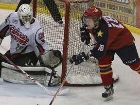 Wellington Dukes forward Andrew McCann circles the Fort Frances Lakers net during Day 2 action Wednesday night at the 2014 Dudley Hewitt Cup in Wellington. (BRUCE BELL/The Intelligencer)