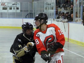 Point Edward Pacers' forward Cory Burr checks over his shoulder for a teammate to pass the ball to while being checked by Steve Jaworski of the Windsor Clippers in the 2nd period of their game on Wednesday night. The Clippers used eight unanswered goals in the 2nd period to defeat the Pacers 18-7. SHAUN BISSON/THE OBSERVER/QMI AGENCY