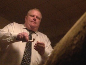 A still from a video that was offered for sale to the website Gawker.com. The seller told the website that the pipe in Mayor Rob Ford's hand contained crack cocaine. (Photo courtesy Gawker.com)