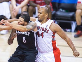 Toronto Raptors Chuck Hayes and Brooklyn Nets  Deron Williams during 2nd half  NBA playoff action  at the Air Canada Centre in Toronto, Ont. on Thursday May 1, 2014. Ernest Doroszuk/Toronto Sun/QMI Agency
