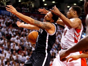 Raptors' DeMar DeRozan battles with the Nets' Deron Williams in Toronto's 115-113 win in Game 5 on Wednesday night. (Craig Robertson/Toronto Sun)