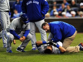 Toronto Blue Jays outfielder Melky Cabrera is tended to after being hit by a pitch against the Kansas City Royals at Kauffman Stadium in Kansas, April 30, 2014. (DENNY MEDLEY/USA Today)